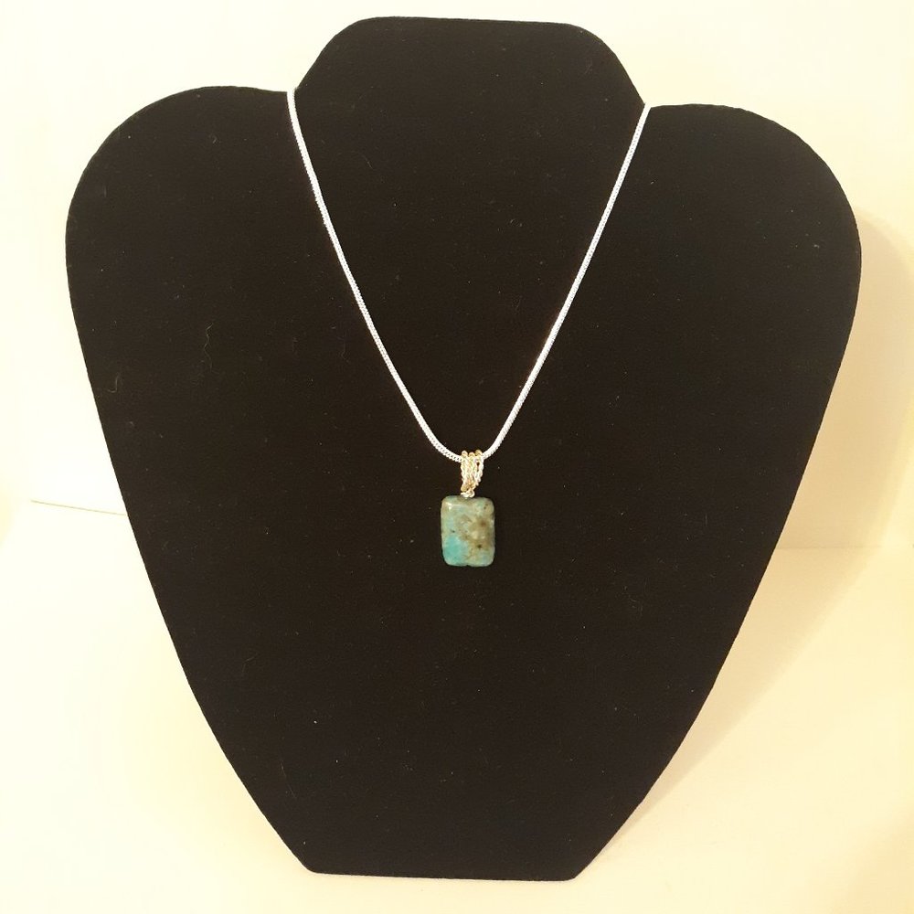genuine hand made 3/4" turquoise pendant with silver wire loop & 925 chain.